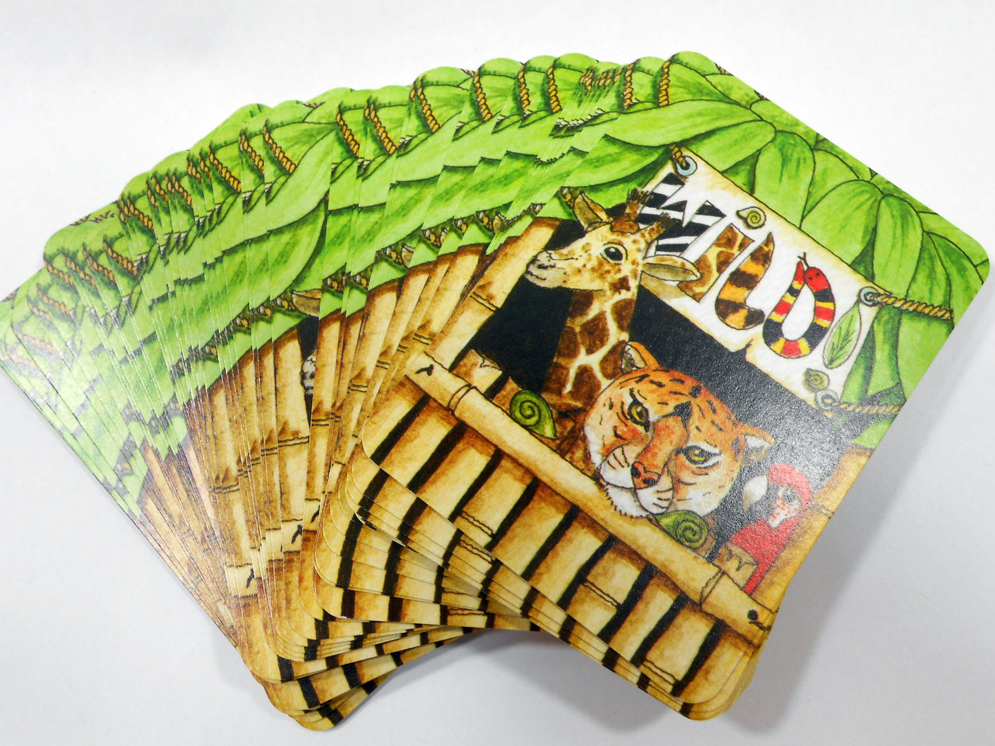 Wild! Deck of Playing Cards - Unique Seek-N-Find feature where you find hidden images in cards - Features artwork of animals by Peter Wood