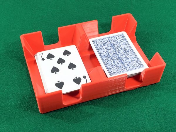 Deck of playing cards in red tray or caddy