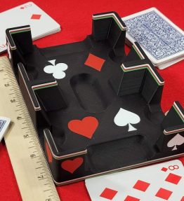 Playing cards laying around black fancy ritzy card tray