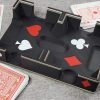 Playing cards laying around black fancy ritzy card tray