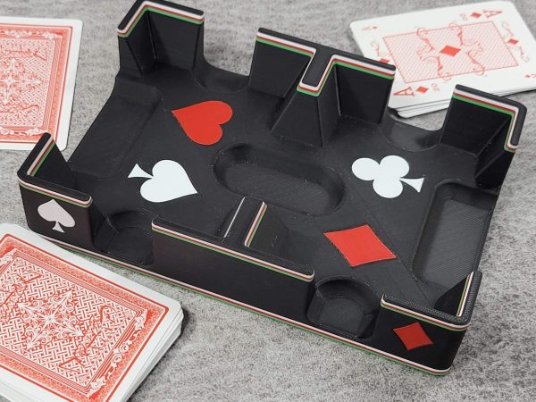 Playing cards laying around black fancy ritzy card tray