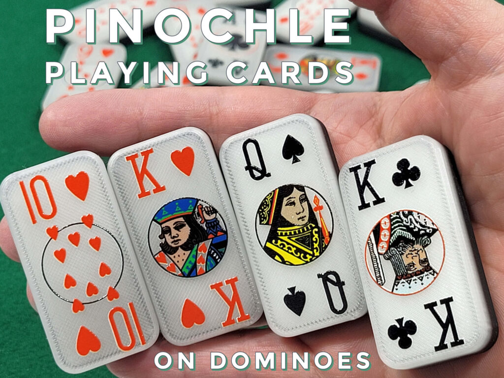Domino pinochle playing cards held in hand